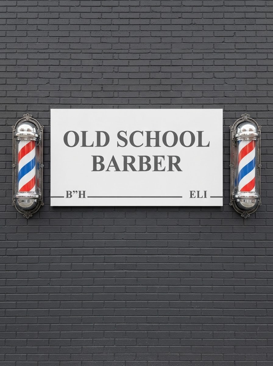 The Old School Barber sign mounted on brick between two barber poles
